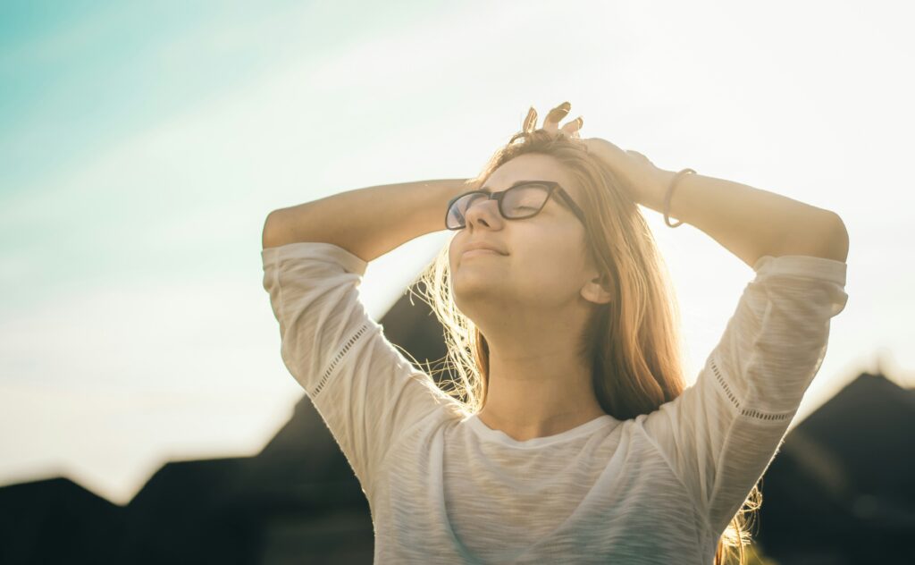 Woman looking to the sky with a smile