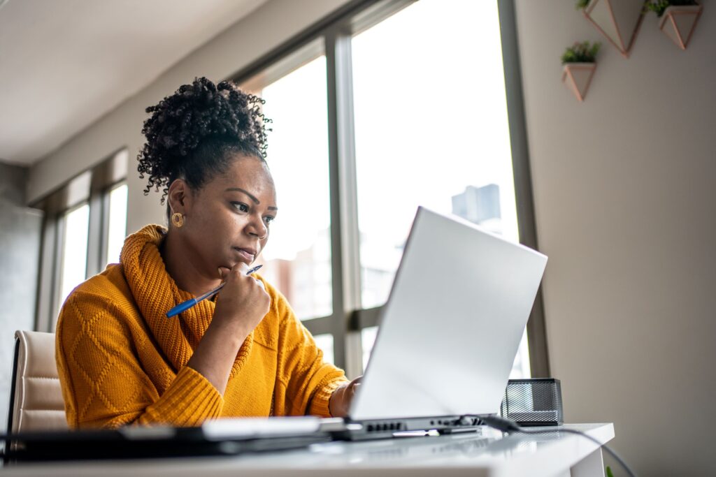 Woman researching on a laptop